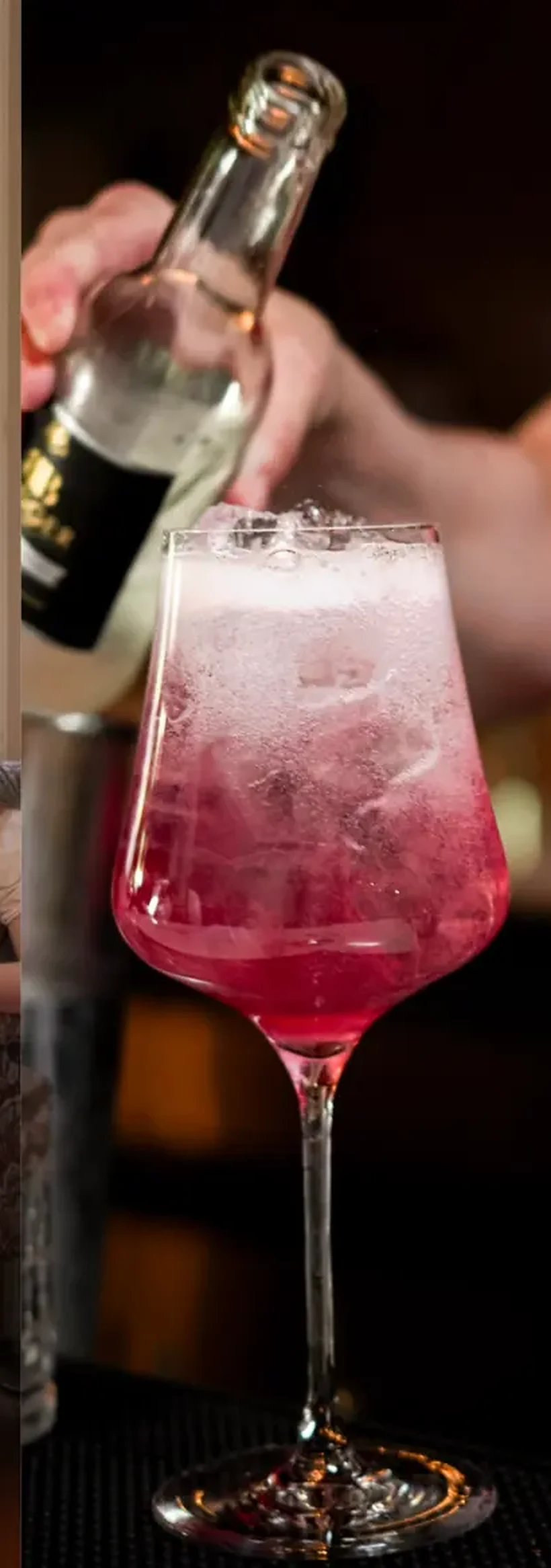 Pink cocktail being prepared