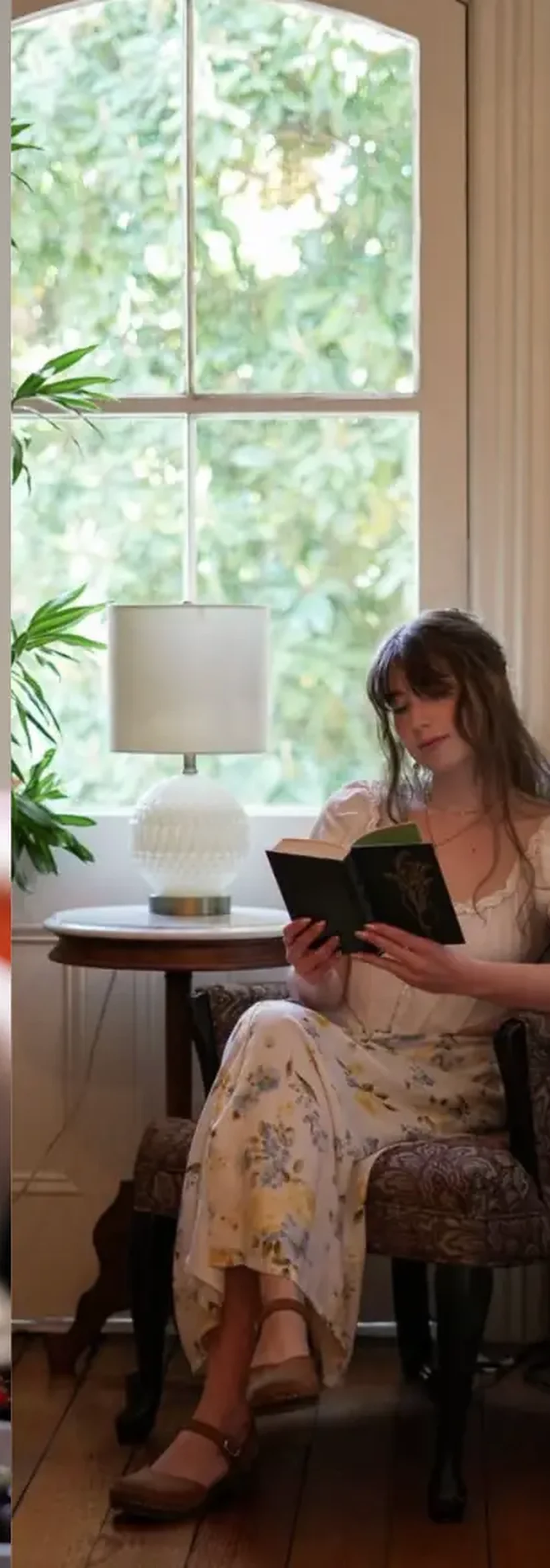 Guest reading beside a bright hospitality window