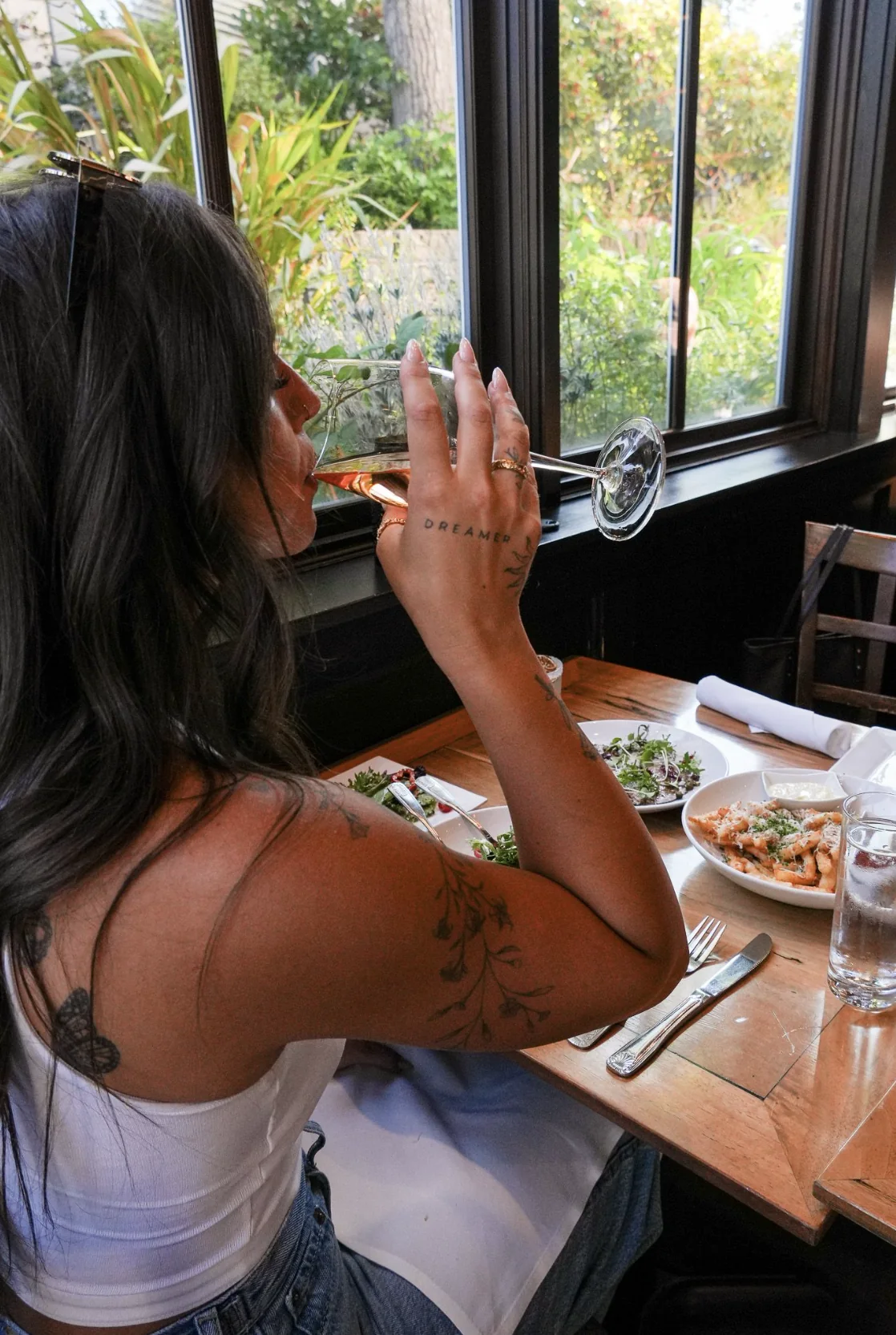 A guest enjoying a cocktail at a Southern Oregon hospitality venue photographed by Legacy Studio