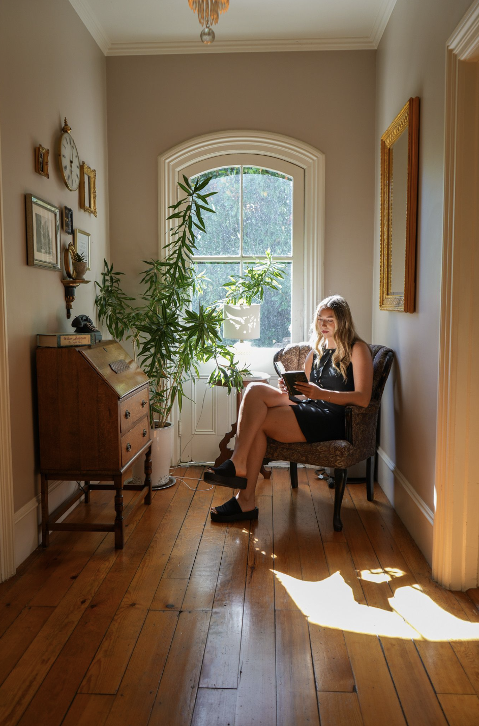 A guest relaxing with a book at The McCall House boutique hotel